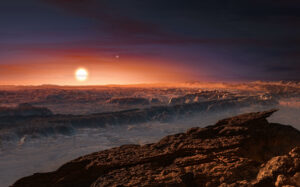 This artist’s impression shows a view of the surface of the planet Proxima b orbiting the red dwarf star Proxima Centauri, the closest star to the Solar System. The double star Alpha Centauri AB also appears in the image to the upper-right of Proxima itself. Proxima b is a little more massive than the Earth and orbits in the habitable zone around Proxima Centauri, where the temperature is suitable for liquid water to exist on its surface.