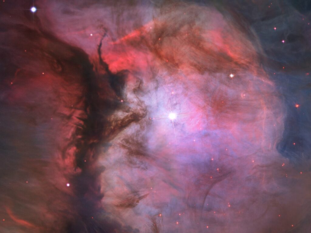 A massive star is illuminating this small region, called M43, and sculpting the landscape of dust and gas. Astronomers call the area a miniature Orion Nebula because of its small size and the single star that is shaping it. The Orion Nebula itself is much larger and has four hefty stars that are carving the dust-and-gas terrain.